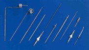 A collection of various medical or surgical cannulas and tubes arranged neatly. These tools are essential for procedures involving fluid delivery or drainage.