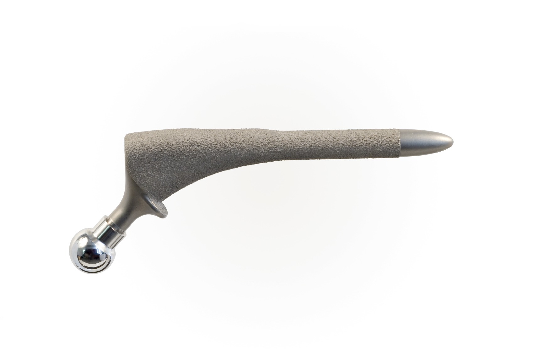Hip prosthesis component featuring a textured gray surface and a polished chrome ball joint, illustrating key elements of hip replacement technology.